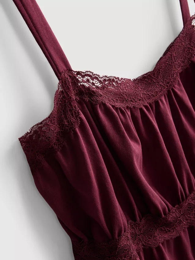 Top tipo camisola de algodón con dobladillo en forma de pañuelo
