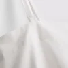 Top tipo camisola de algodón con dobladillo en forma de pañuelo