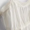 Top tipo camisola de algodón con dobladillo en forma de pañuelo