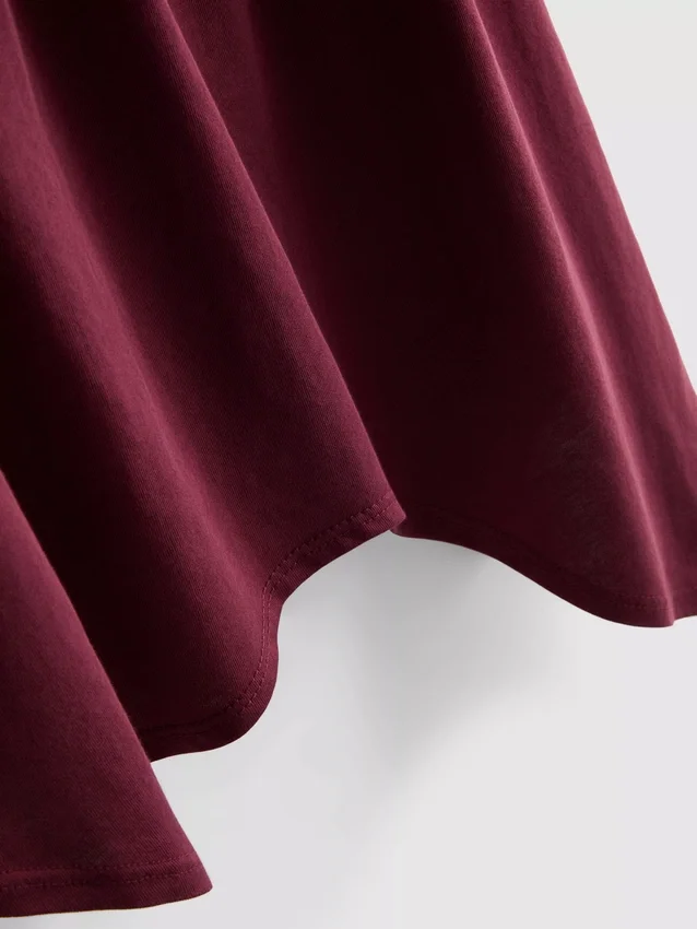 Top tipo camisola de algodón con dobladillo en forma de pañuelo