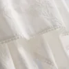 Top tipo camisola de algodón con dobladillo en forma de pañuelo