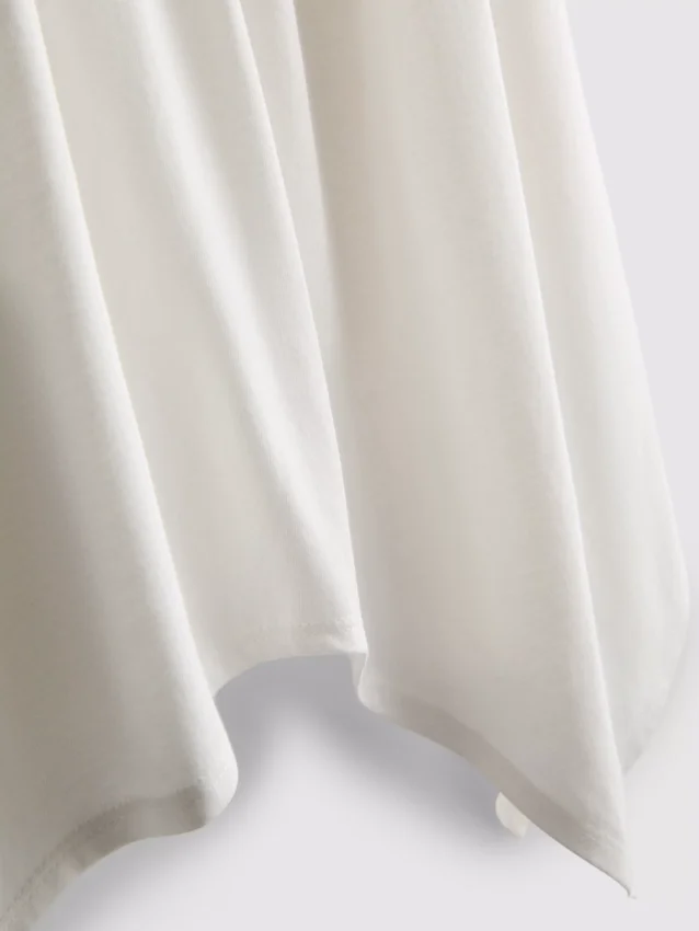 Top tipo camisola de algodón con dobladillo en forma de pañuelo