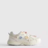 Zapatillas de suela gruesa con detalles florales