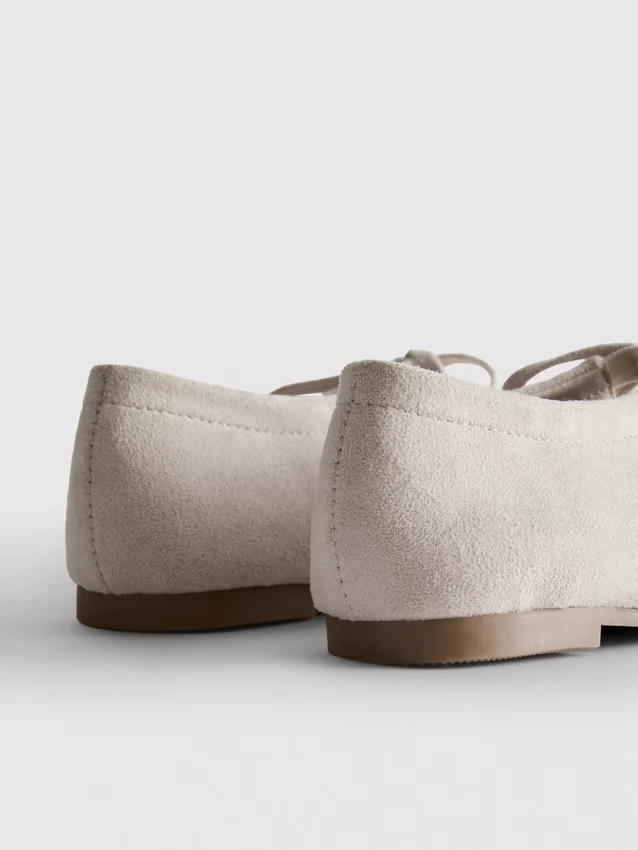 Zapatos planos con detalle de moño