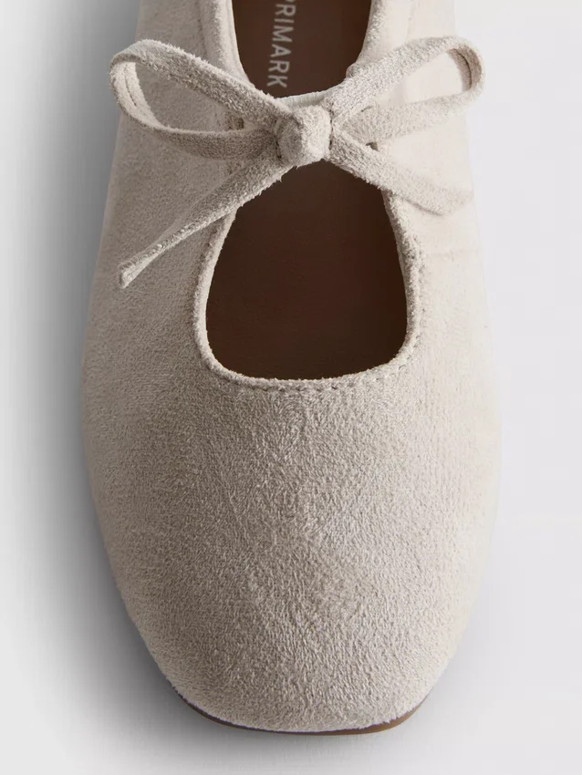 Zapatos planos con detalle de moño